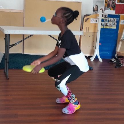 girl playing frisby