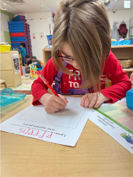 girl completing a worksheet at school