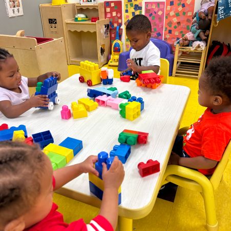 children playing with lego blocks