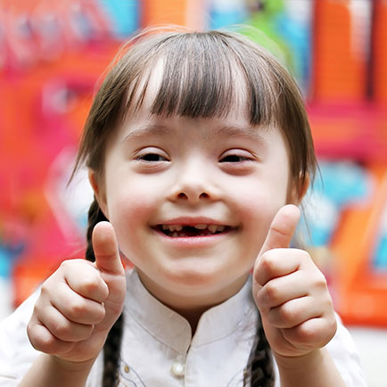smiling girl with Down syndrome